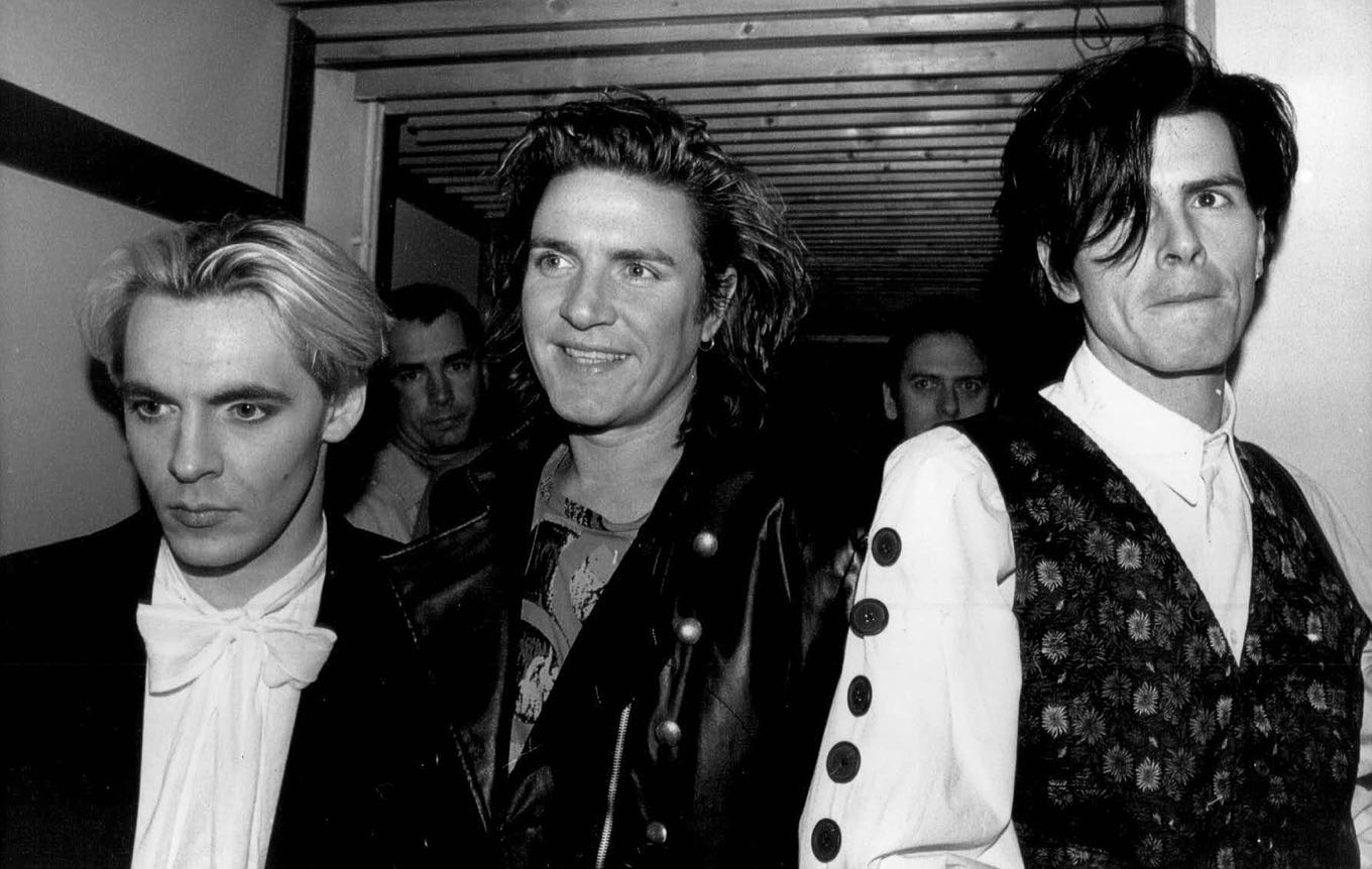 Members of the pop group Duran Duran, who took Milan by storm last night, are shown Dec. 11, 1988, as 1,000 screaming fans greeted them before they played. From left to right: Nick Rhodes, Simon Le Bon and John Taylor. (AP Photo/Press Association/Rebecca Naden)