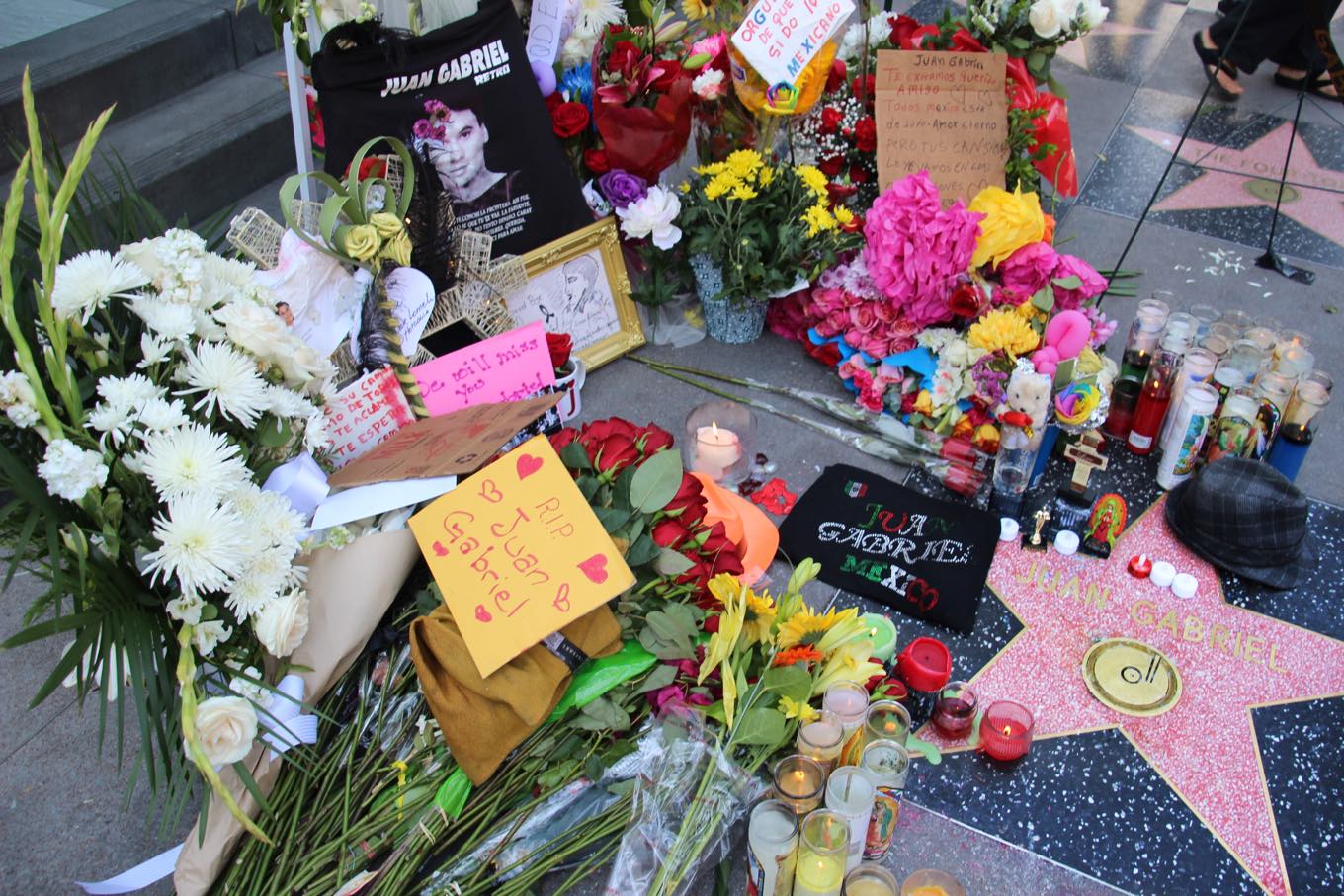 People gather, sing and leave remembrances for Latin sensation Juan Gabriel on Hollywood Blvd on August 29, 2016. (Photo by Ticketmaster)