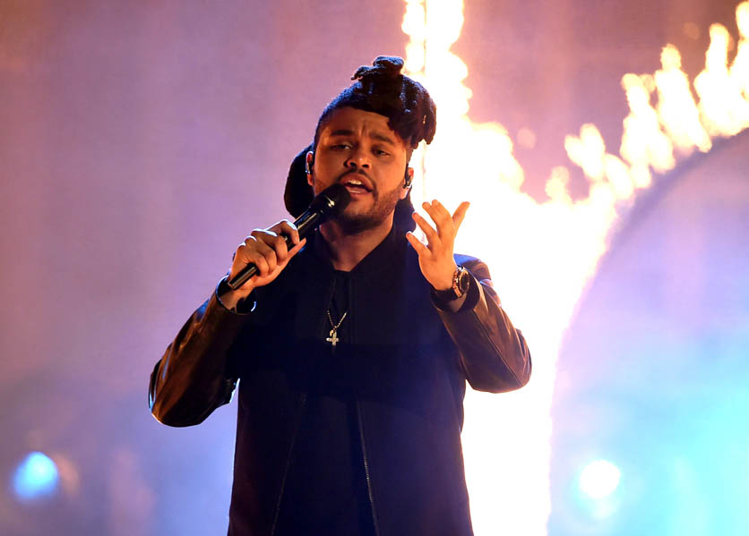 The Weeknd performs onstage during the 2015 American Music Awards at Microsoft Theater on November 22, 2015 in Los Angeles, California. (Photo by: Kevin Winter/Getty Images) 